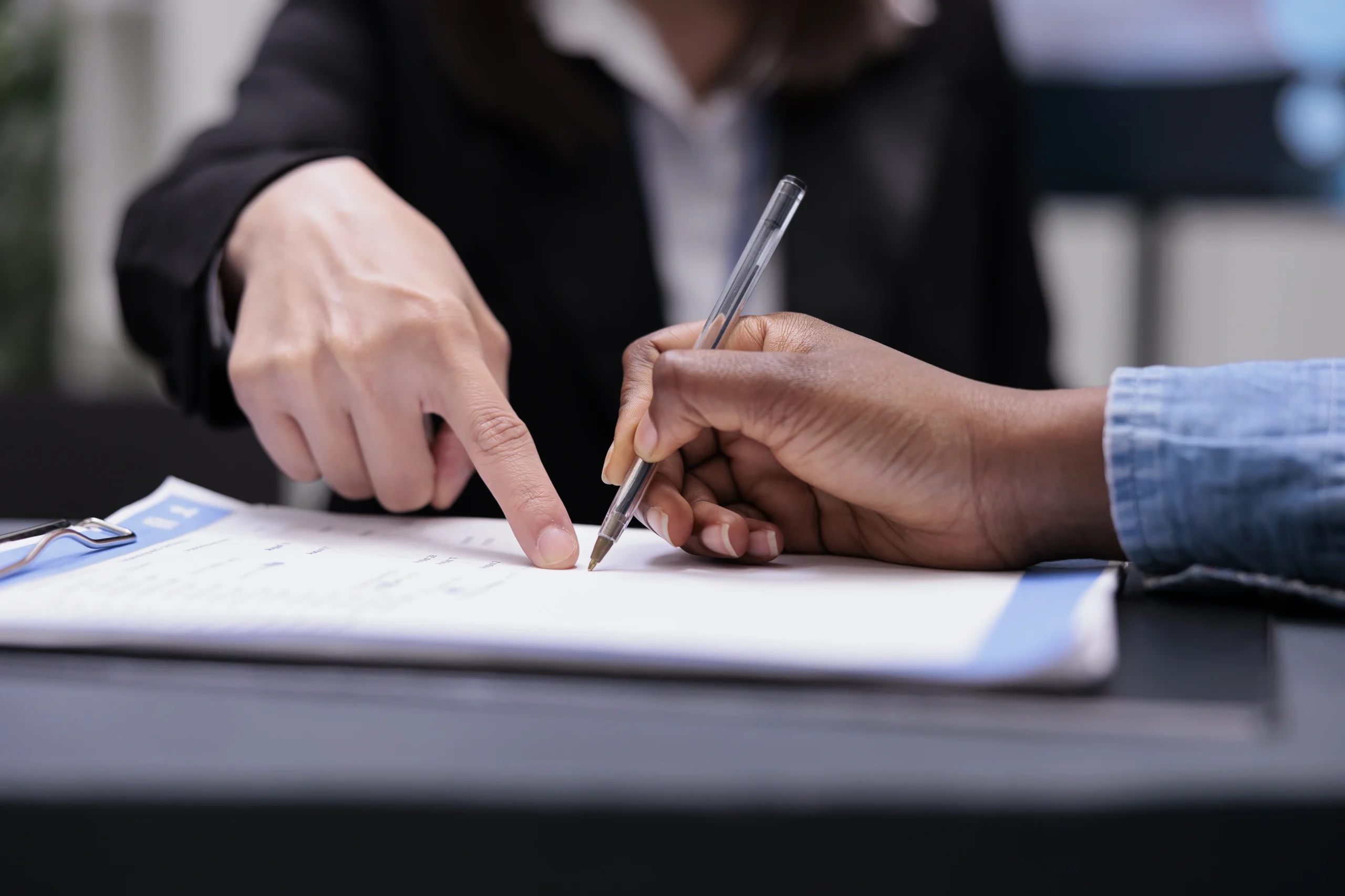 Client signing company registration documents with assistance from a business consultant in Thiruvananthapuram